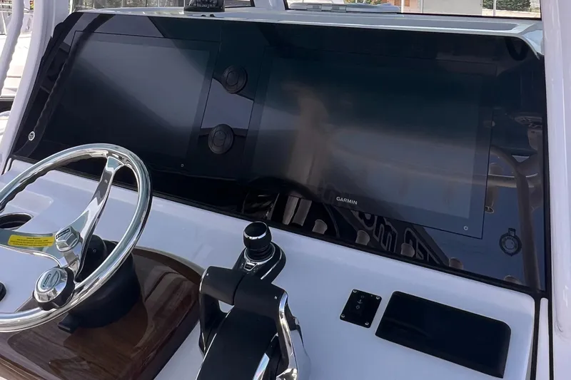 Slide: The Image of 2025 Sportsman Open 352 Center Console dashboard with steering wheel and digital displays. - 5