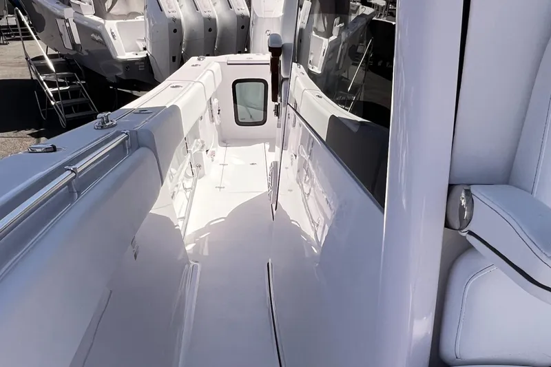 Slide: The Image of 2025 Sportsman Open 352 Center Console boat interior, showcasing sleek white deck design. - 7