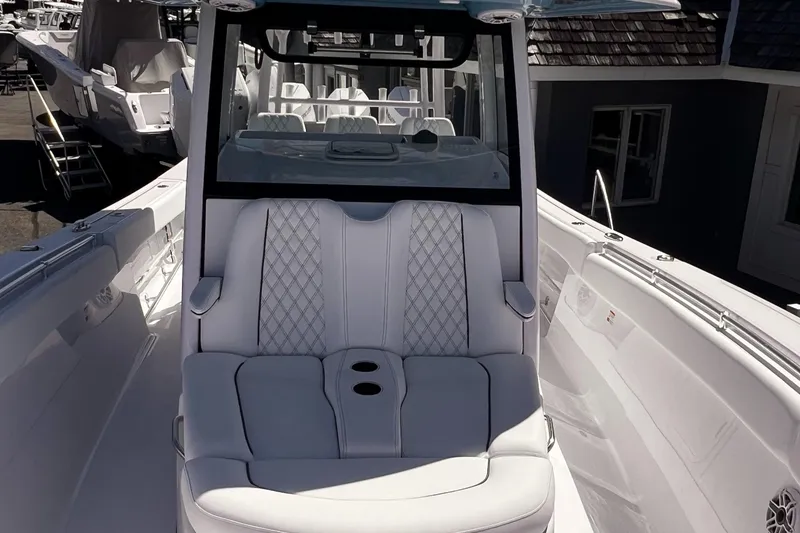 Slide: The Image of 2025 Sportsman Open 352 Center Console boat with luxurious seating and sleek design. - 8