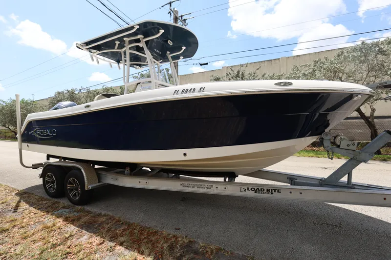 Slide: The Image of 2019 Robalo R242 Explorer boat on trailer, side view, outdoors. - 7
