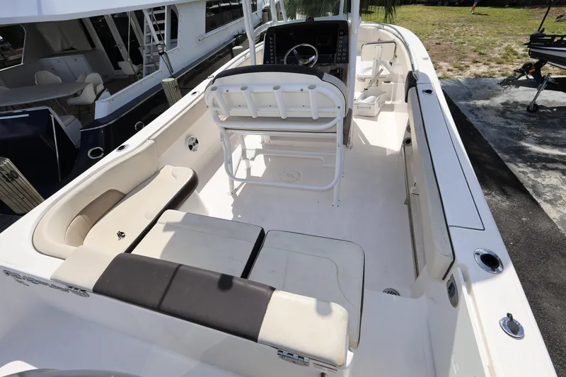 Slide: The Image of 2019 Robalo R242 Explorer boat interior with seating and steering console. - 9