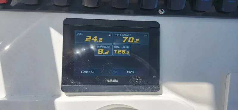 Slide: The Image of Yamaha display on 2022 Sea Hunt Ultra 234 showing fuel usage and trip data. - 8