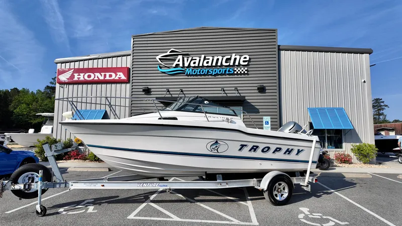 Slide: The Image of 1998 Bayliner Trophy 1802 Cuddy boat on trailer at Avalanche Motorsports. - 1