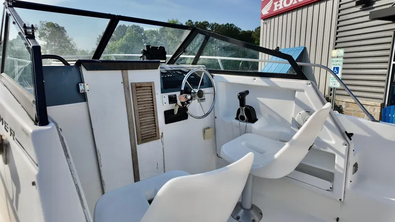 Slide: The Image of 1998 Bayliner Trophy 1802 Cuddy boat interior with steering wheel and seating. - 11