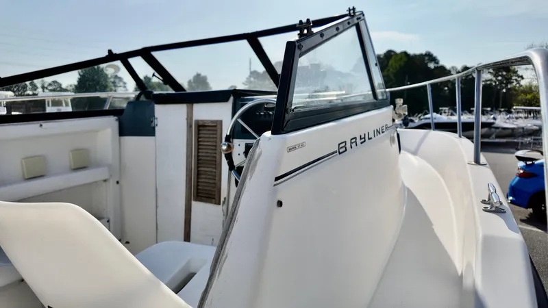 Slide: The Image of 1998 Bayliner Trophy 1802 Cuddy boat interior with steering wheel and seating. - 8