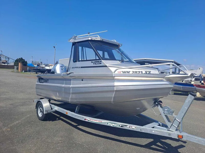 Slide: The Image of 2021 Stabicraft 1850 Supercab X1 boat on trailer under clear blue sky. - 0