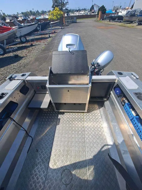Slide: The Image of 2021 Stabicraft 1850 Supercab X1 boat interior with motor, docked outdoors. - 3