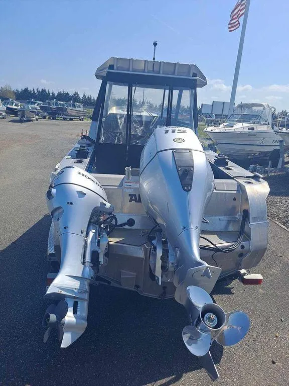 Slide: The Image of 2021 Stabicraft 1850 Supercab X1 with dual outboard motors, parked outdoors. - 5