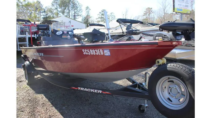 Slide: The Image of 2021 Tracker Super Guide V-16 SC boat on trailer, parked outdoors. - 11