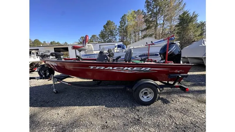 Slide: The Image of 2021 Tracker Super Guide V-16 SC boat on trailer, parked outdoors. - 12