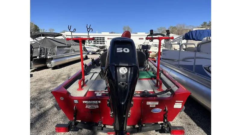 Slide: The Image of 2021 Tracker Super Guide V-16 SC boat with 50 HP motor, parked outdoors. - 3