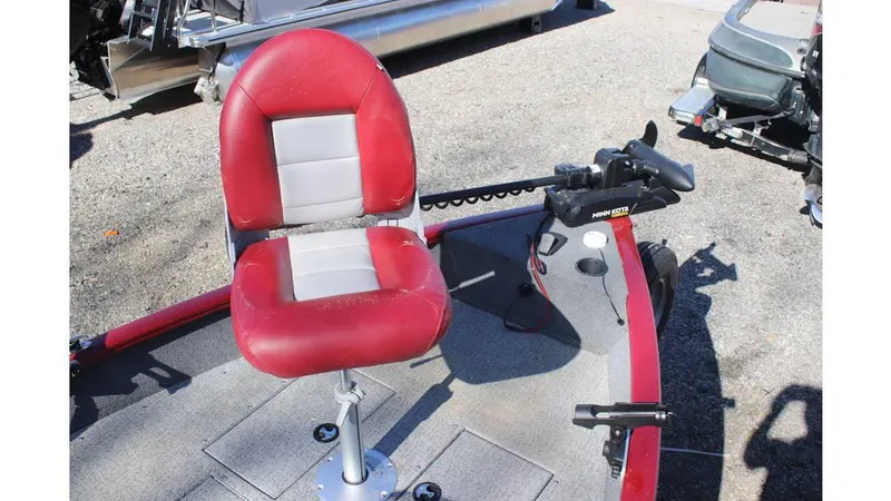 Slide: The Image of 2021 Tracker Super Guide V-16 SC boat with red and gray seating, trolling motor. - 8