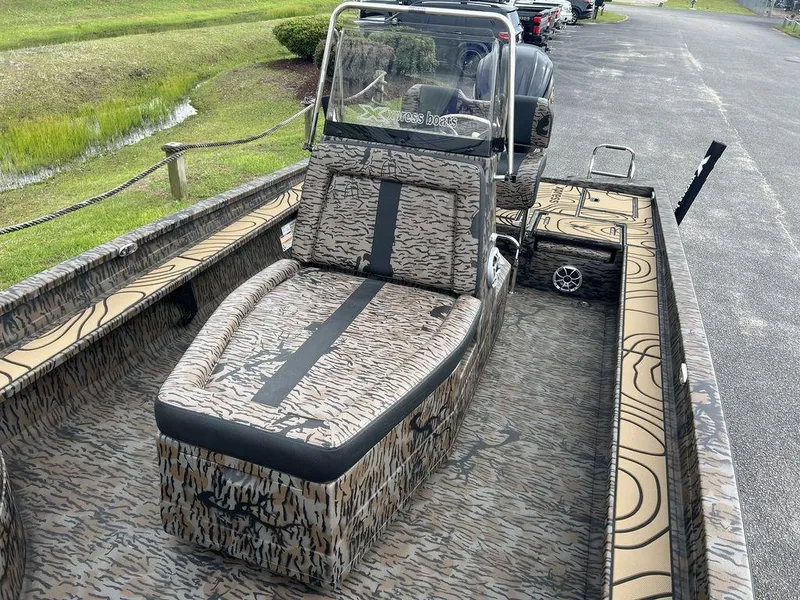 Slide: The Image of 2025 Xpress X23B Lounge boat with camouflage seating and sleek design. - 12