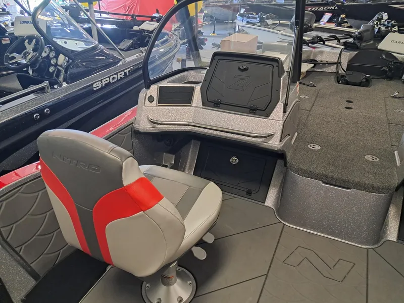 Slide: The Image of 2025 Nitro ZV2O SPT PRO boat interior with gray and red seating. - 4