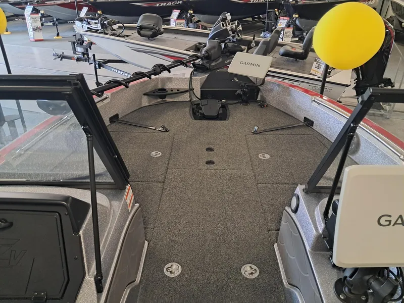 Slide: The Image of 2025 Nitro ZV2O SPT PRO boat interior with Garmin equipment and spacious deck. - 5