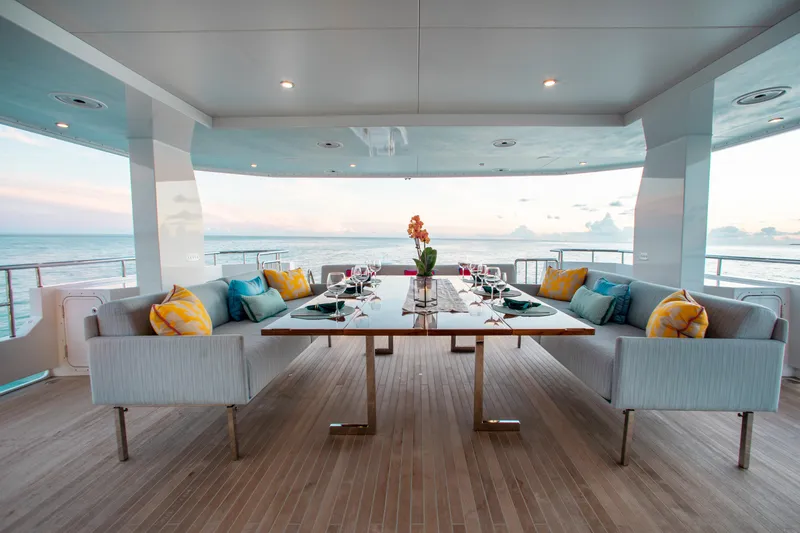 Slide: The Image of Luxurious dining area on 2017 Mengi Yay 105 Custom Explorer yacht with ocean view. - 2