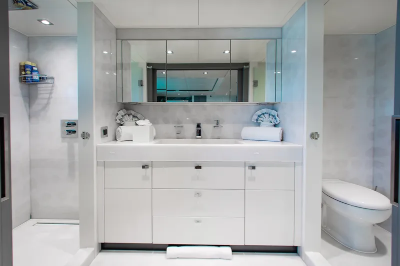 Slide: The Image of Luxurious bathroom in 2017 Mengi Yay 105 Custom Explorer yacht, featuring modern white fixtures. - 21