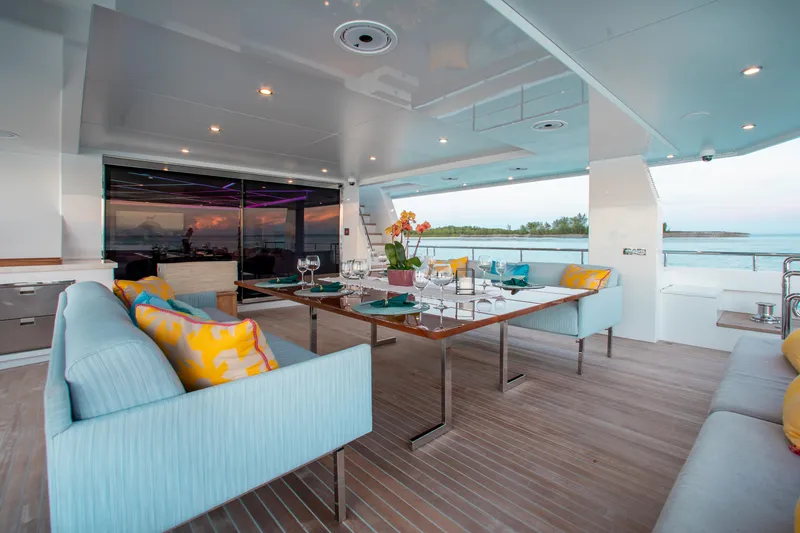 Slide: The Image of Luxurious 2017 Mengi Yay Custom Explorer yacht interior with elegant dining setup and ocean view. - 3