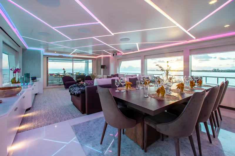 Slide: The Image of Luxurious interior of 2017 Mengi Yay 105 Custom Explorer yacht with elegant dining area and scenic views. - 6