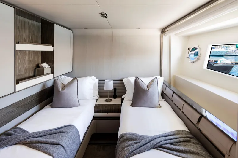 Slide: The Image of Luxurious twin cabin interior of 2017 Azimut Grande 30 Metri yacht, featuring elegant decor. - 22