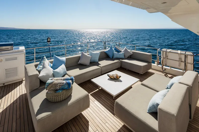Slide: The Image of Luxurious Azimut Grande 30 Metri yacht deck with elegant seating, ocean view, 2017 model. - 23