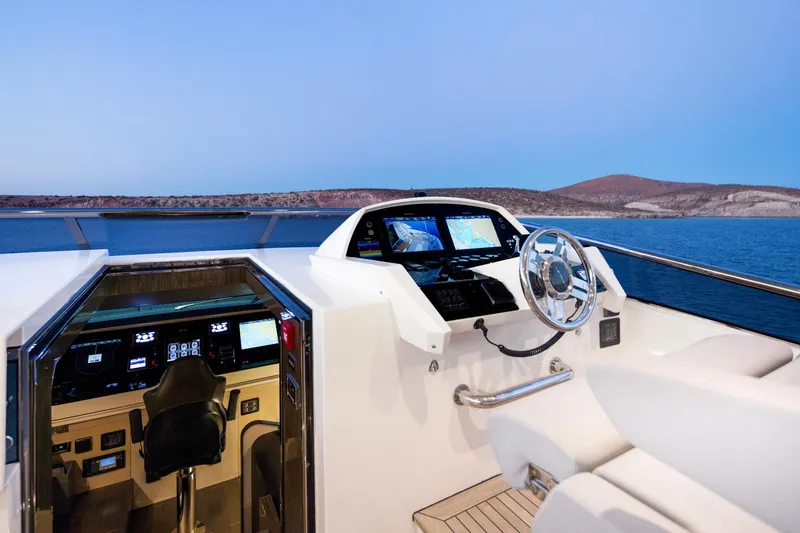 Slide: The Image of Luxurious Azimut Grande 30 Metri yacht helm, 2017 model, overlooking serene blue waters. - 29