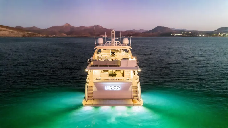 Slide: The Image of Luxurious 2017 Azimut Grande 30 Metri yacht illuminated on serene waters at dusk. - 33