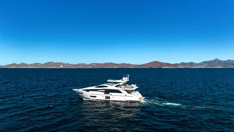 Slide: The Image of Azimut Grande 30 Metri yacht cruising on open sea, 2017 model, with scenic mountain backdrop. - 6