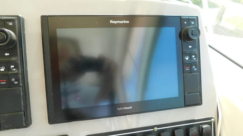 Slide: The Image of Raymarine navigation display on 2017 Boston Whaler 315 Conquest boat dashboard. - 15