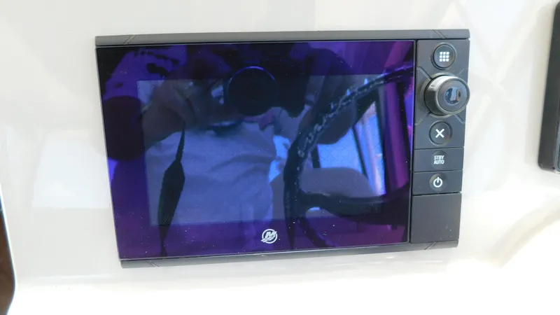 Slide: The Image of Control panel on a 2017 Boston Whaler 315 Conquest boat. - 16