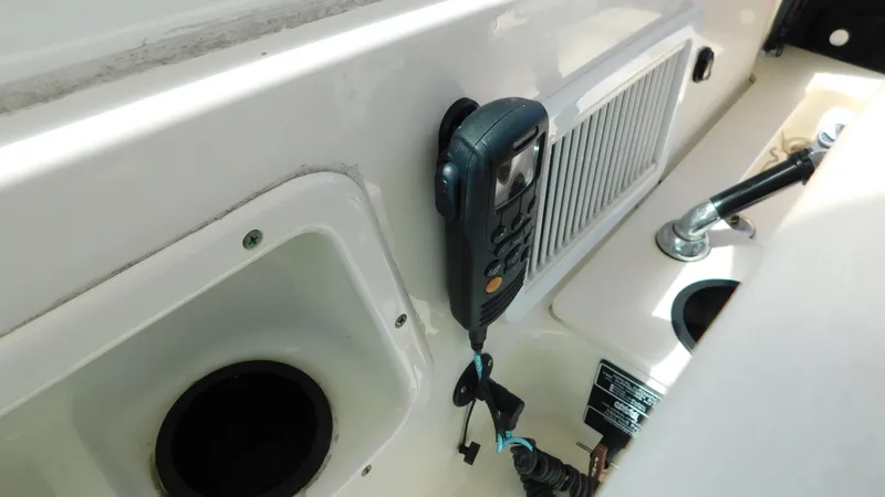 Slide: The Image of Interior view of a 2017 Boston Whaler 315 Conquest boat with mounted radio equipment. - 19