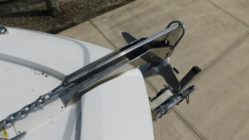 Slide: The Image of Bow anchor of 2017 Boston Whaler 315 Conquest boat on a concrete surface. - 29