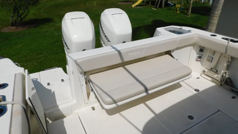 Slide: The Image of 2017 Boston Whaler 315 Conquest boat with dual engines and foldable bench seat. - 31