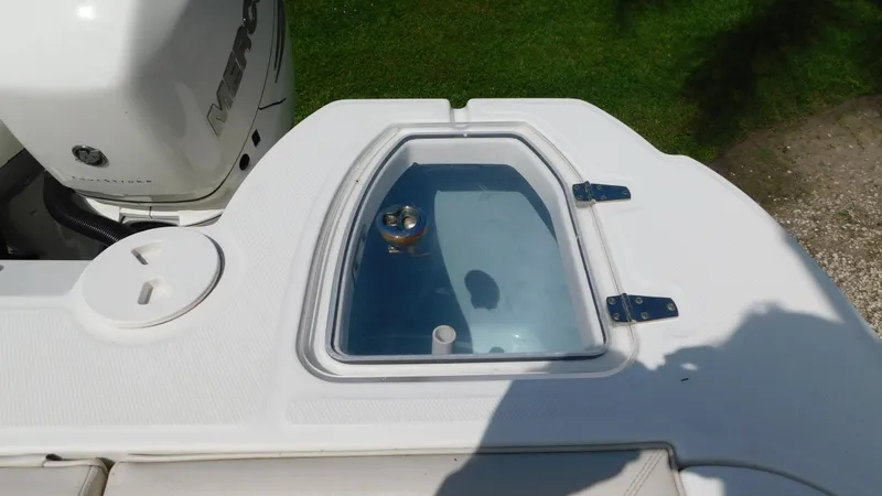 Slide: The Image of 2017 Boston Whaler 315 Conquest livewell with clear lid and white deck. - 33