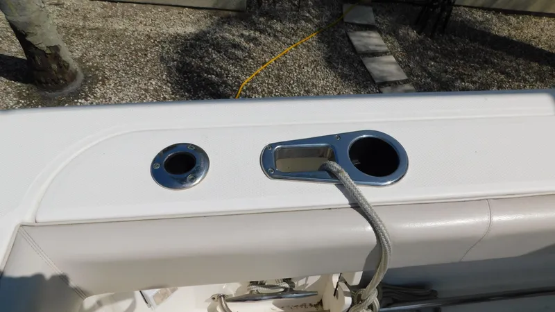 Slide: The Image of 2017 Boston Whaler 315 Conquest boat deck with rope and cup holders. - 38