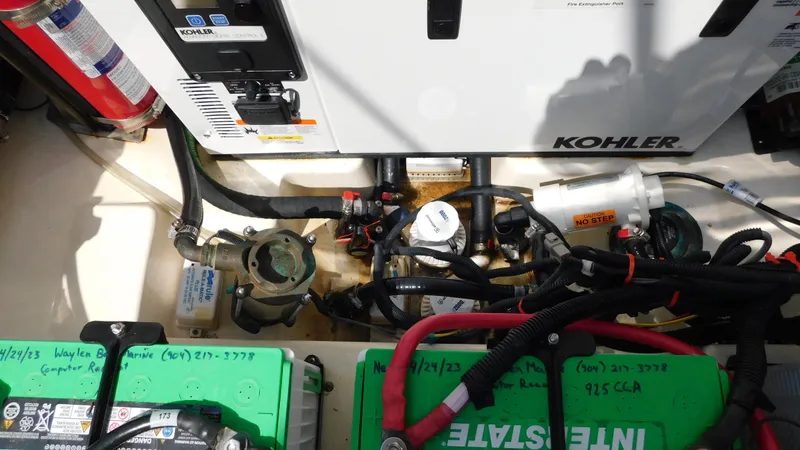 Slide: The Image of Engine compartment of a 2017 Boston Whaler 315 Conquest with Kohler generator and batteries. - 42