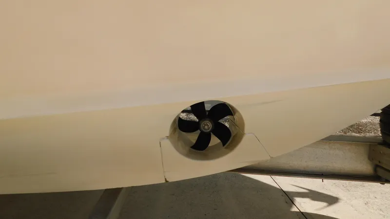 Slide: The Image of 2017 Boston Whaler 315 Conquest boat hull with visible propeller detail. - 43