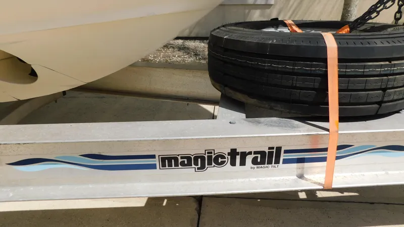 Slide: The Image of Trailer with spare tire for 2017 Boston Whaler 315 Conquest boat. - 44