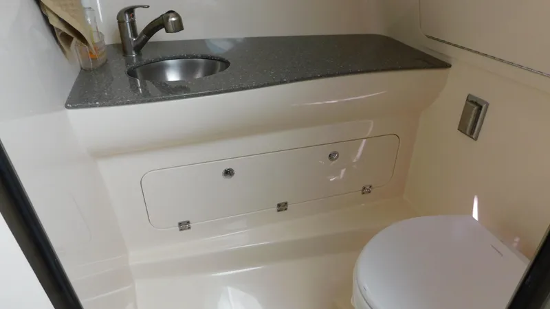 Slide: The Image of 2017 Boston Whaler 315 Conquest bathroom with sink and toilet. - 6