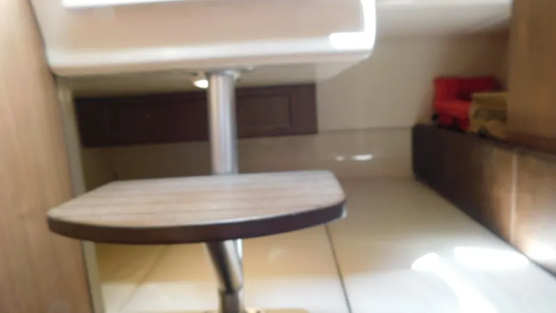 Slide: The Image of Interior of 2017 Boston Whaler 315 Conquest, featuring a compact cabin space. - 9