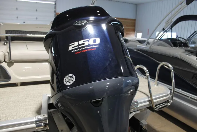 Slide: The Image of 2018 Bennington 25RSB boat with a 250 horsepower outboard motor in a showroom. - 15