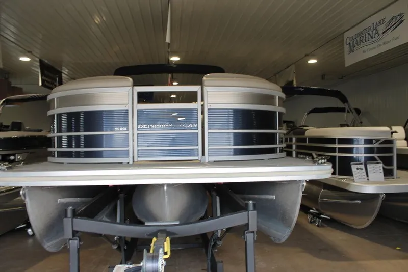 Slide: The Image of 2018 Bennington 25RSB pontoon boat displayed indoors on a trailer. - 19