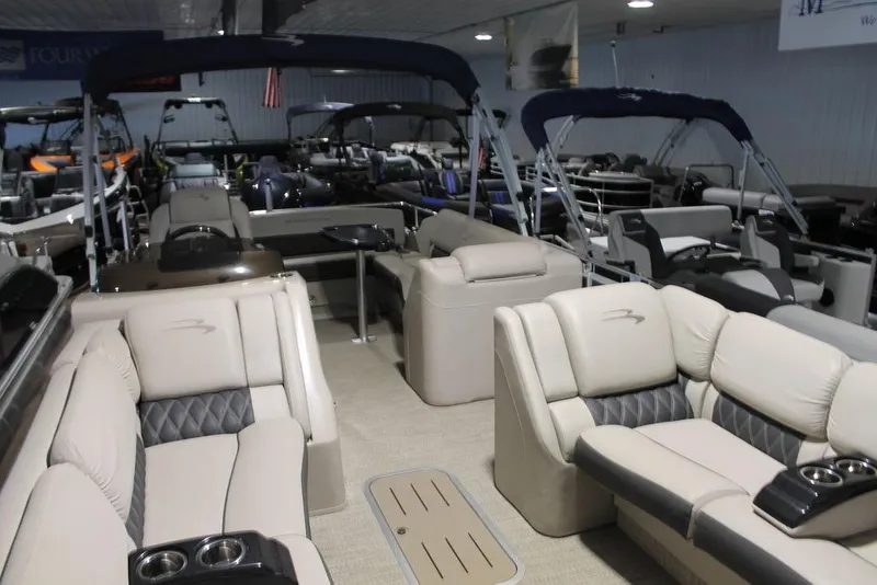 Slide: The Image of 2018 Bennington 25RSB pontoon boat interior with luxurious seating and cup holders. - 3
