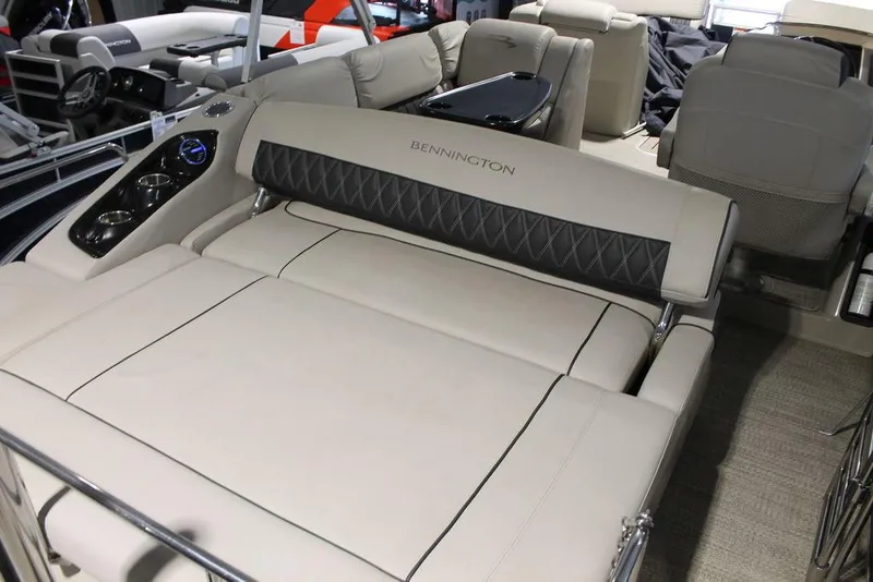 Slide: The Image of 2018 Bennington 25RSB boat interior with luxurious seating and modern design. - 6