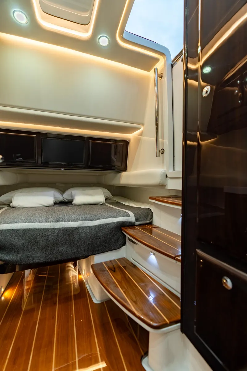 Slide: The Image of Luxurious 2021 HCB Suenos cabin interior with wooden flooring and ambient lighting. - 17