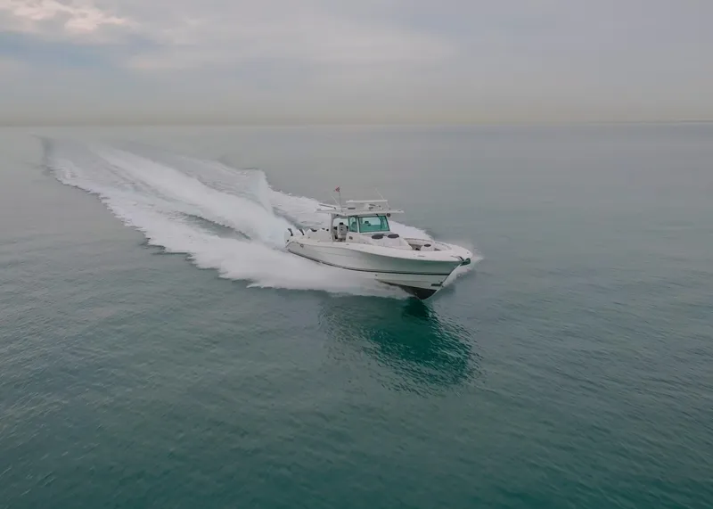 Slide: The Image of 2021 HCB Suenos boat cruising on calm ocean waters. - 2