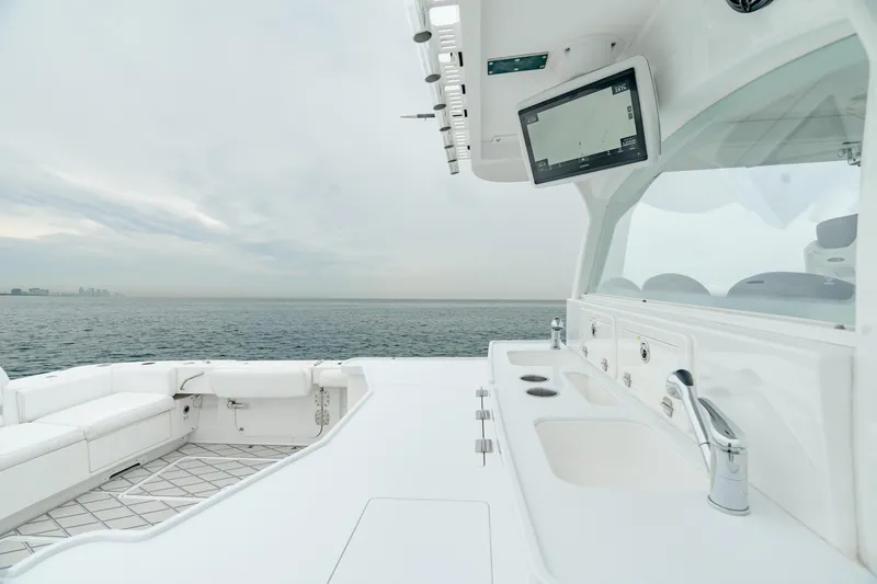 Slide: The Image of 2021 HCB Suenos yacht interior with ocean view, featuring sleek white design and modern amenities. - 21