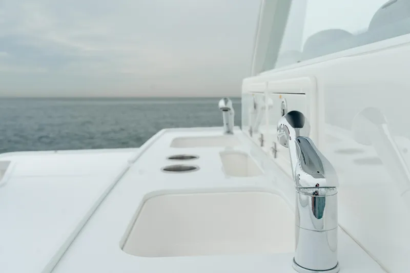 Slide: The Image of Luxury HCB Suenos 2021 yacht deck with sleek chrome fixtures and ocean view. - 22