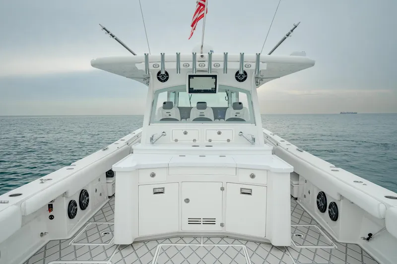 Slide: The Image of 2021 HCB Suenos boat deck with fishing rods and ocean view. - 26