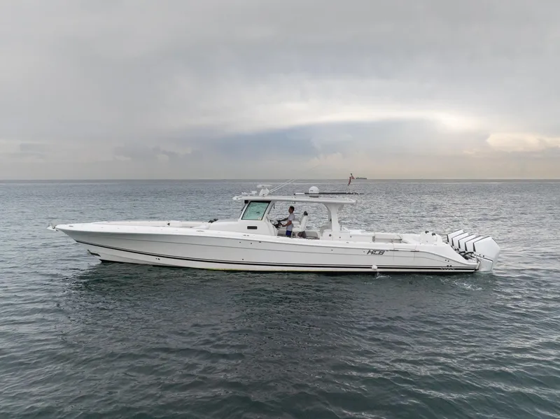 Slide: The Image of 2021 HCB Suenos boat cruising on calm ocean waters under cloudy skies. - 3
